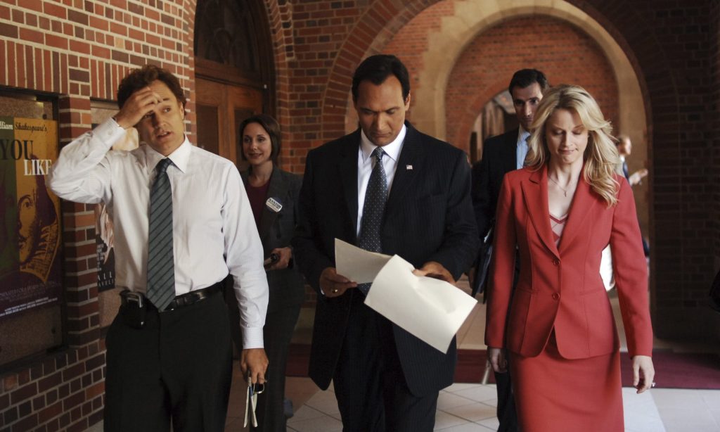 people in business clothes walking while working