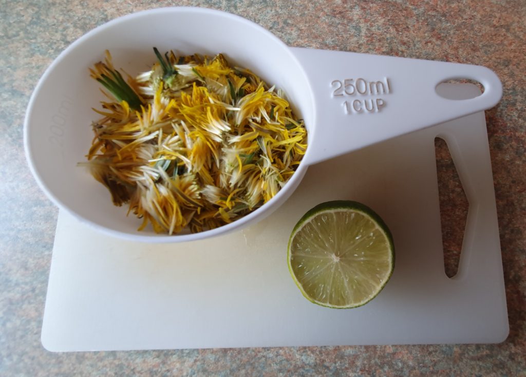 photos of petals in a plastic dose of one cup, with a lime next to it