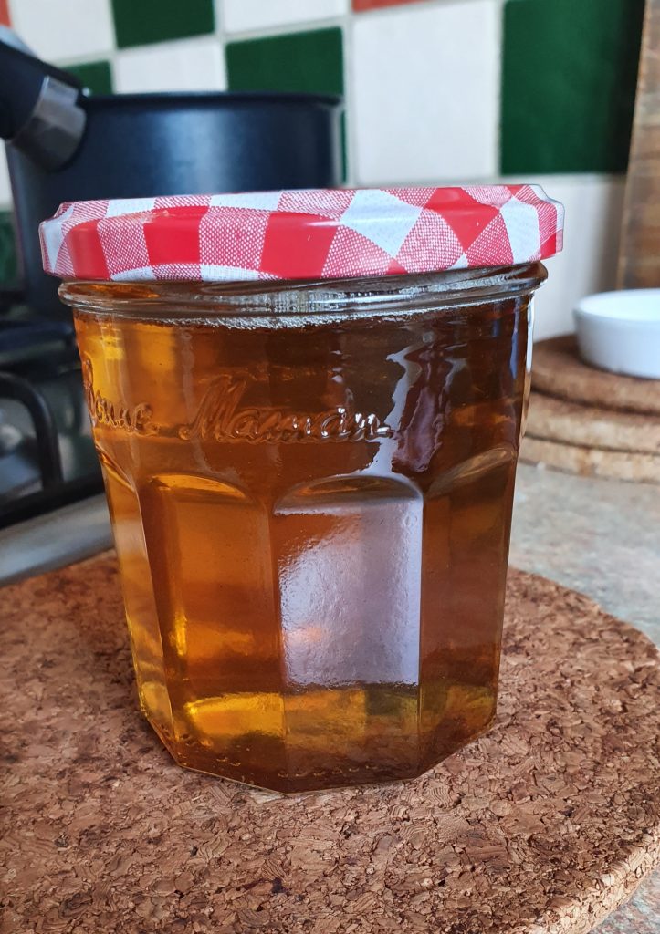 glass jar with a cap, with the honey inside